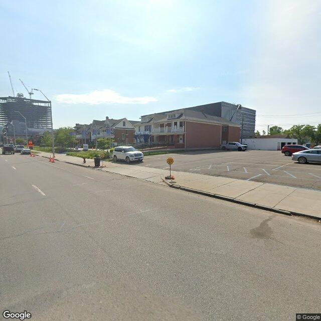 July 2026, Google: the closest the camera comes, about fifty meters west. The houses still stand; the steel is going up.