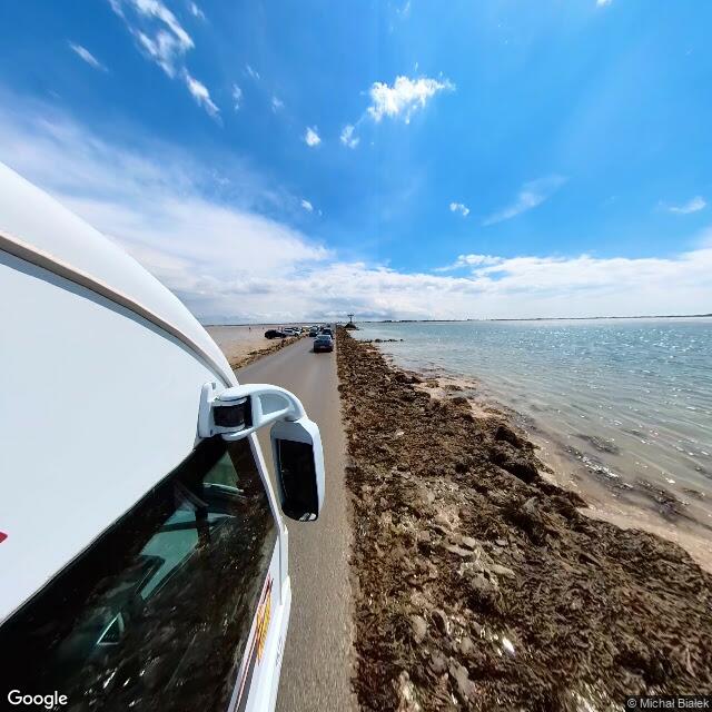 Passage du Gois at low tide, looking out over the tidal flats toward the island
