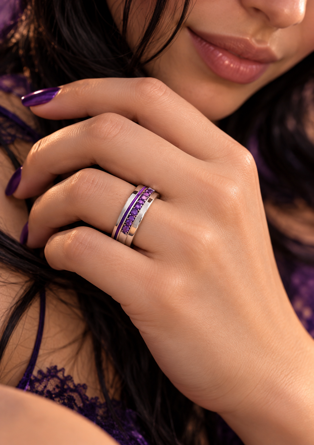 Lyra’s ring: silver band channel-set with round violet stones, on a hand with violet nails